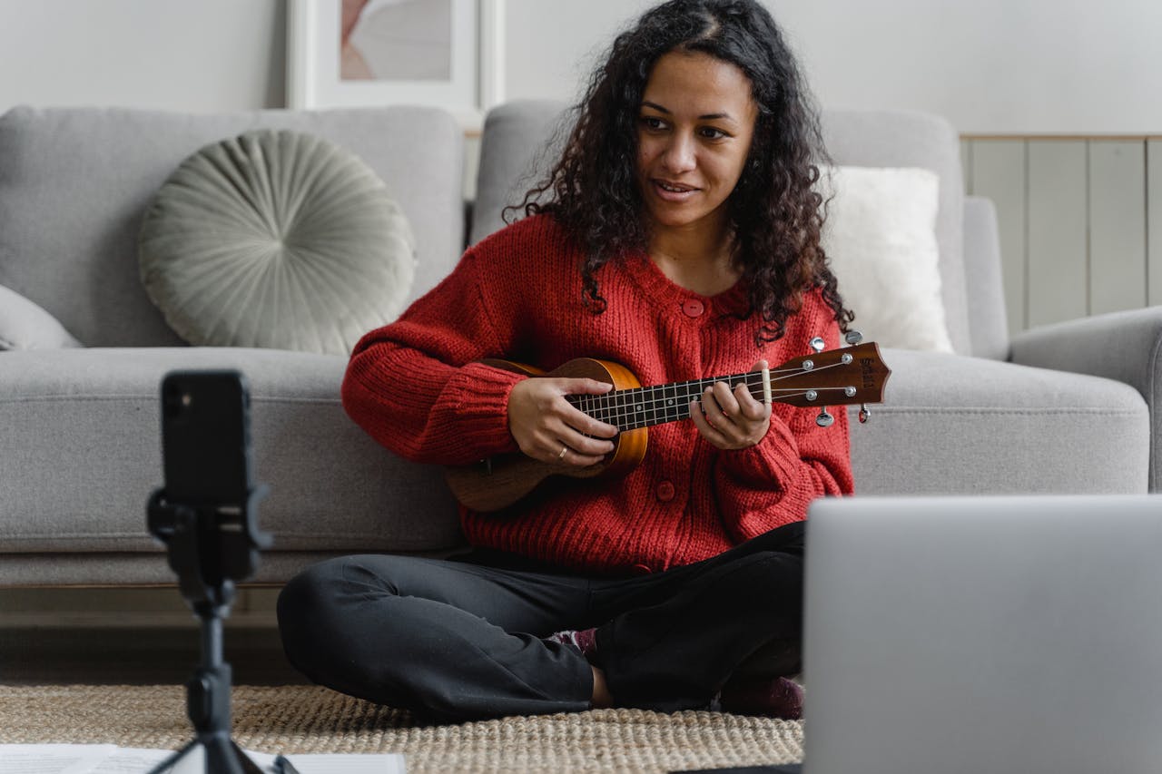 girl learning ukulele