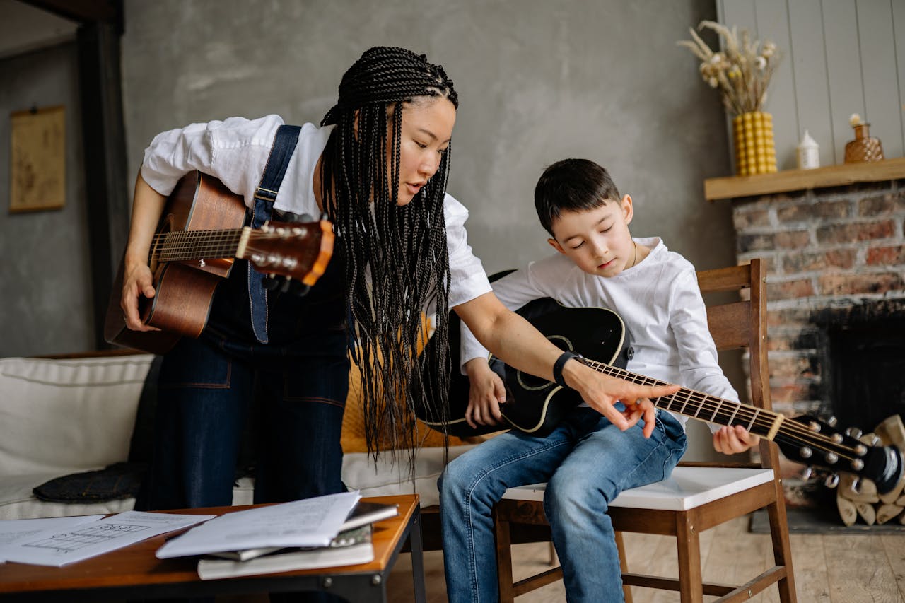 boy learning guitar